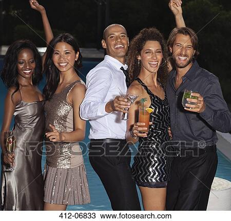 Friends dancing at party by swimming pool View Large Photo Image Stock Image - Friends dancing at party by swimming pool. Fotosearch