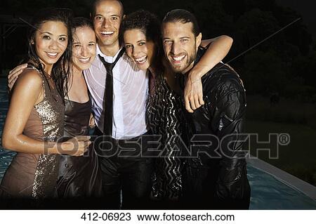 Friends in evening wear soaked by swimming pool View Large Photo Image Stock Image - Friends in evening wear soaked by swimming pool . Fotosearch