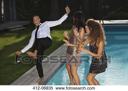 Friends playing by swimming pool View Large Photo Image Stock Photography - Friends playing by swimming pool. Fotosearch