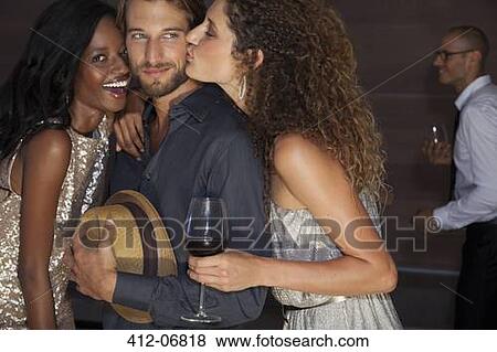 Friends relaxing together at party View Large Photo Image Stock Photo - Friends relaxing together at party. Fotosearch