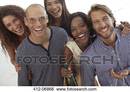 Stock Photograph - Friends smiling together at party. Fotosearch