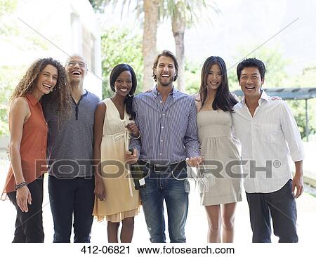 Friends smiling together outdoors View Large Photo Image Stock Image - Friends smiling together outdoors. Fotosearch