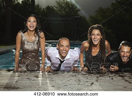Fully dressed friends climbing out of swimming pool View Large Photo Image Stock Image - Fully dressed friends climbing out of swimming pool. Fotosearch
