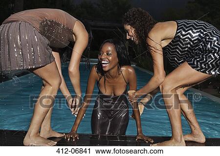 Fully dressed woman climbing out of swimming pool View Large Photo Image Stock Image - Fully dressed woman climbing out of swimming pool. Fotosearch