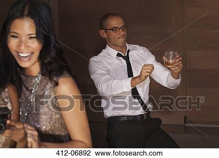 Stock Image - Man dancing at party. Fotosearch