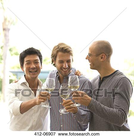 Stock Photo - Men toasting each other with wine. Fotosearch