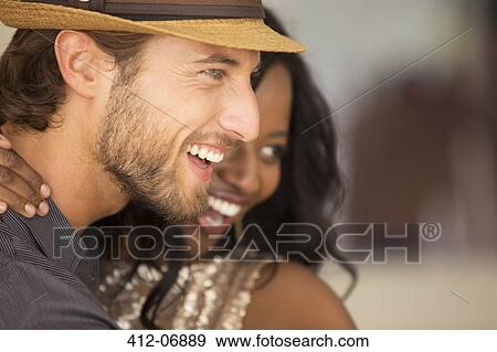 Smiling couple hugging View Large Photo Image Stock Photo - Smiling couple hugging. Fotosearch
