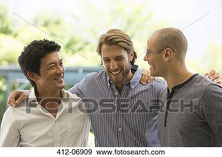 Smiling men talking outdoors View Large Photo Image Stock Photo - Smiling men talking outdoors. Fotosearch