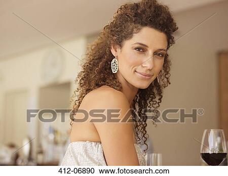 Smiling woman having glass of wine View Large Photo Image Stock Image - Smiling woman having glass of wine. Fotosearch
