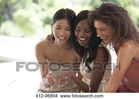 Woman showing off engagement ring View Large Photo Image Picture - Woman showing off engagement ring. Fotosearch