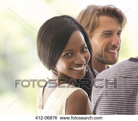 Woman smiling at party View Large Photo Image Stock Photograph - Woman smiling at party. Fotosearch