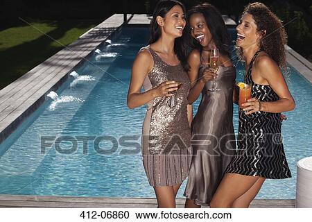 Women having drinks by swimming pool View Large Photo Image Stock Image - Women having drinks by swimming pool. Fotosearch