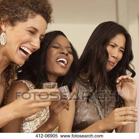Women having strong drinks at party View Large Photo Image Stock Photography - Women having strong drinks at party. Fotosearch