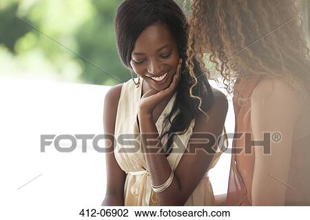 Women talking indoors View Large Photo Image Stock Image - Women talking indoors. Fotosearch