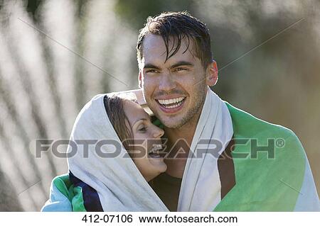 Couple wrapped in towel outdoors View Large Photo Image Stock Photograph - Couple wrapped in towel outdoors. Fotosearch