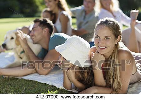 Family relaxing in backyard View Large Photo Image Stock Image - Family relaxing in backyard. Fotosearch