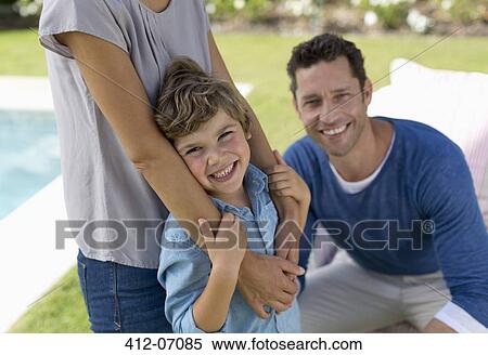 Family smiling in backyard View Large Photo Image Stock Photography - Family smiling in backyard. Fotosearch