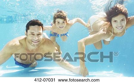 Family swimming in pool View Large Photo Image Stock Image - Family swimming in pool. Fotosearch