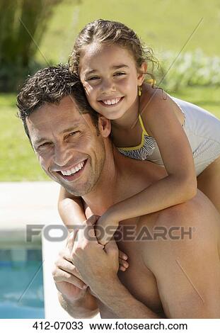 Father and daughter smiling by swimming pool View Large Photo Image Stock Image - Father and daughter smiling by swimming pool. Fotosearch