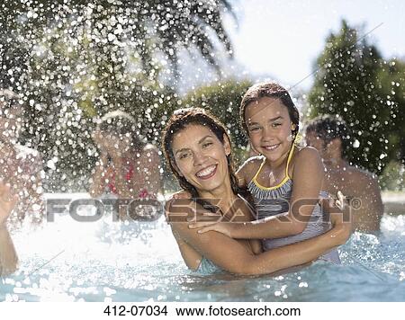 Mother and daughter in swimming pool View Large Photo Image Picture - Mother and daughter in swimming pool. Fotosearch