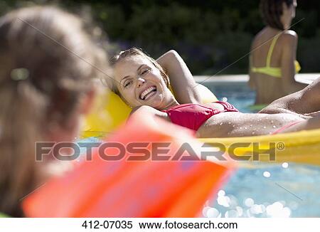 Mother and daughter in swimming pool View Large Photo Image Stock Photography - Mother and daughter in swimming pool. Fotosearch