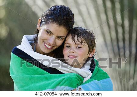 Picture - Mother and son wrapped in towel. Fotosearch