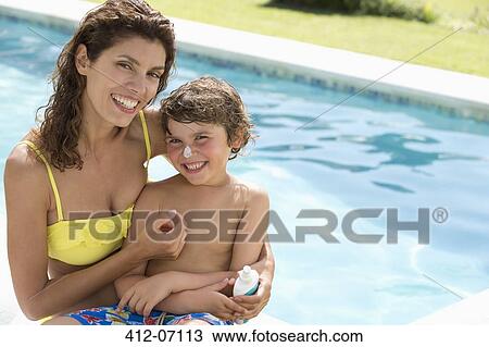 Mother applying moisturizer to son's nose View Large Photo Image Stock Image - Mother applying moisturizer to son's nose. Fotosearch