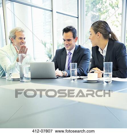 Stock Photo - Business people meeting in conference room. Fotosearch
