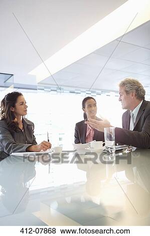 Business people meeting in conference room View Large Photo Image Stock Photo - Business people meeting in conference room. Fotosearch