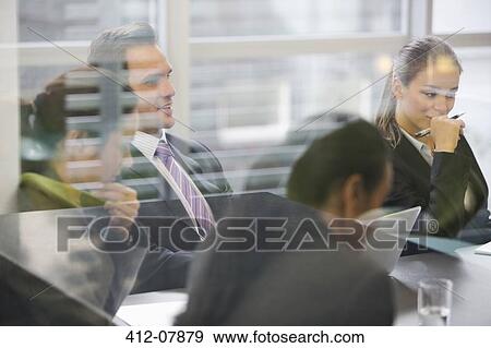 Stock Photo - Business people meeting in conference room. Fotosearch