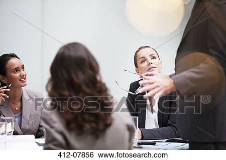 Stock Photograph - Business people meeting in conference room. Fotosearch