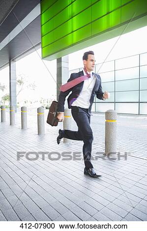 Stock Image - Businessman running. Fotosearch