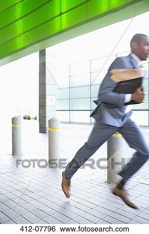 Businessman running View Large Photo Image Stock Photograph - Businessman running. Fotosearch