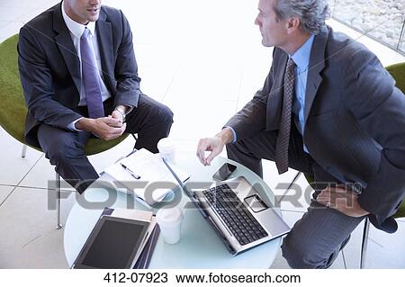 Stock Image - Businessmen meeting. Fotosearch