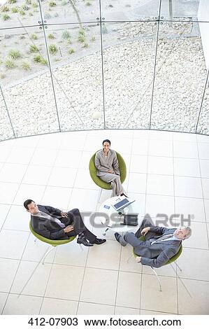 High angle portrait of business people meeting in lobby View Large Photo Image Stock Image - High angle portrait of business people meeting in lobby. Fotosearch