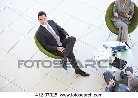 High angle portrait of businessman in meeting View Large Photo Image Stock Photography - High angle portrait of businessman in meeting. Fotosearch