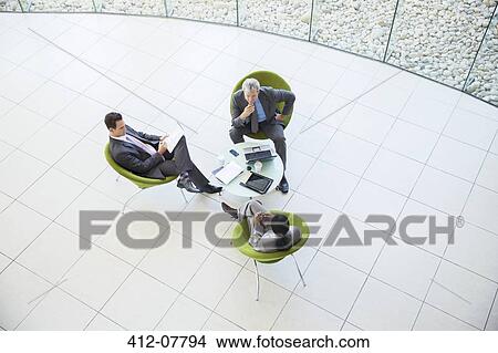 Picture - High angle view of business people in meeting. Fotosearch