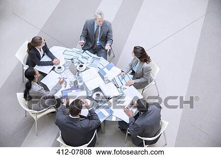 High angle view of business people meeting in conference room View Large Photo Image Stock Photo - High angle view of business people meeting in conference room. Fotosearch