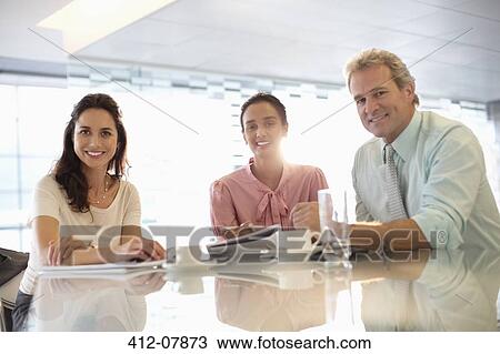 Portrait of confident business people meeting in conference room View Large Photo Image Stock Image - Portrait of confident business people meeting in conference room. Fotosearch