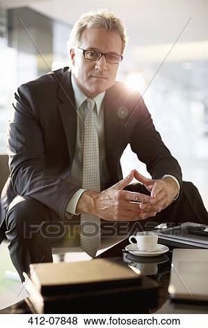 Stock Photo - Portrait of confident businessman. Fotosearch