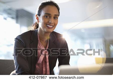 Stock Photo - Portrait of confident businesswoman. Fotosearch