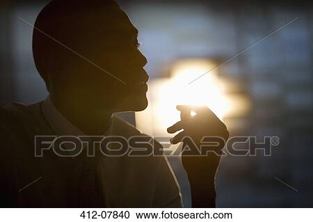 Stock Image - Silhouette of businessman. Fotosearch