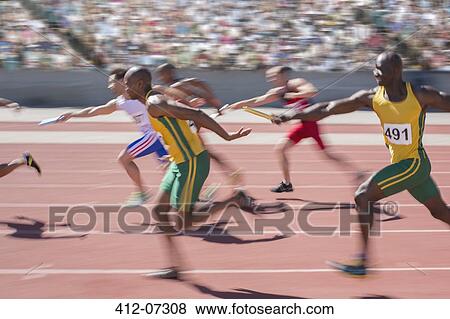 Blurred view of relay runners in race View Large Photo Image Stock Photo - Blurred view of relay runners in race. Fotosearch