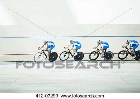 Cyclists racing around velodrome View Large Photo Image Stock Photo - Cyclists racing around velodrome. Fotosearch