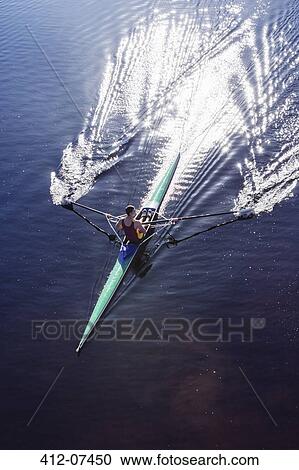 Man rowing scull on lake View Large Photo Image Stock Image - Man rowing scull on lake. Fotosearch