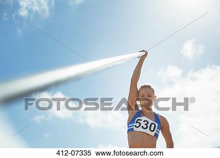 Pole vaulter holding pole View Large Photo Image Stock Photography - Pole vaulter holding pole. Fotosearch