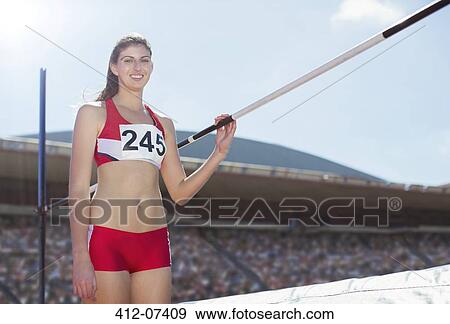 Portrait of high jumper by bar View Large Photo Image Stock Photo - Portrait of high jumper by bar. Fotosearch