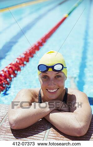 Portrait of smiling swimmer leaning at edge of pool View Large Photo Image Stock Image - Portrait of smiling swimmer leaning at edge of pool. Fotosearch