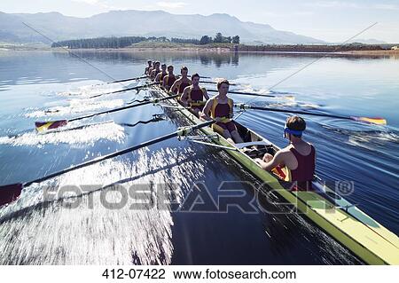Rowing team rowing scull on lake View Large Photo Image Stock Image - Rowing team rowing scull on lake. Fotosearch
