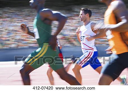 Runners racing on track View Large Photo Image Stock Image - Runners racing on track. Fotosearch